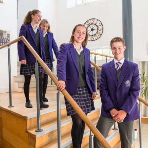 wycliffe students smiling in staircase
