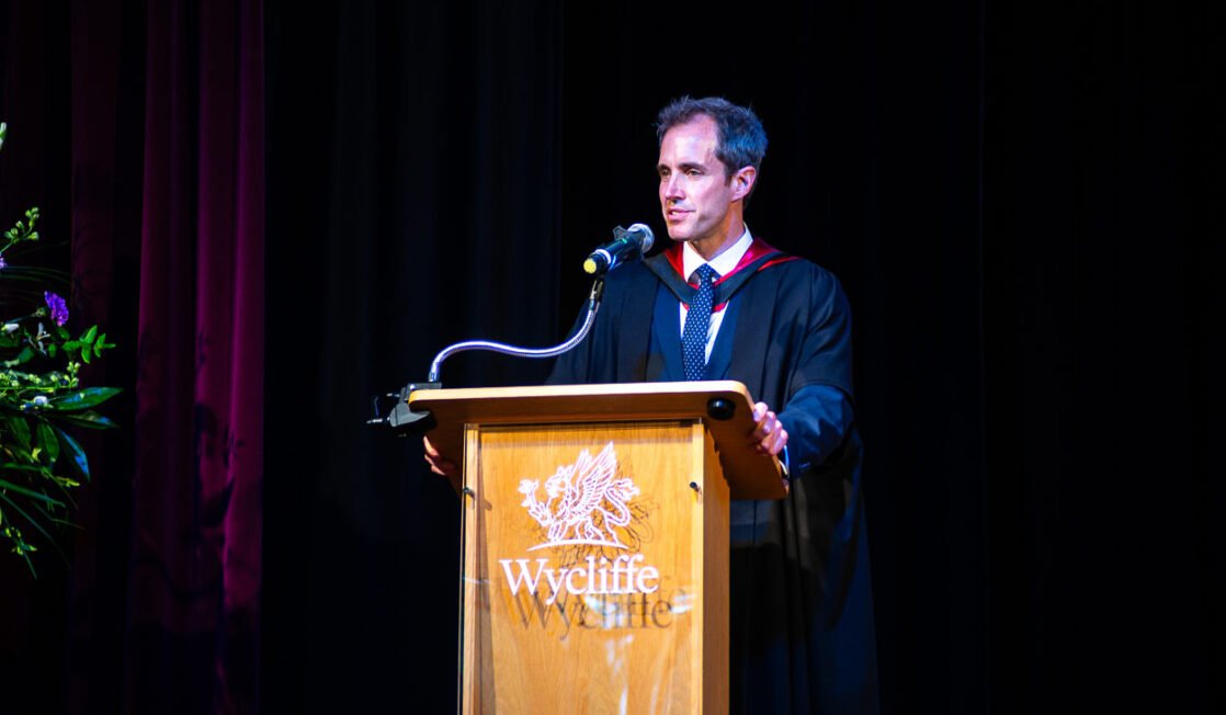Christian at lectern