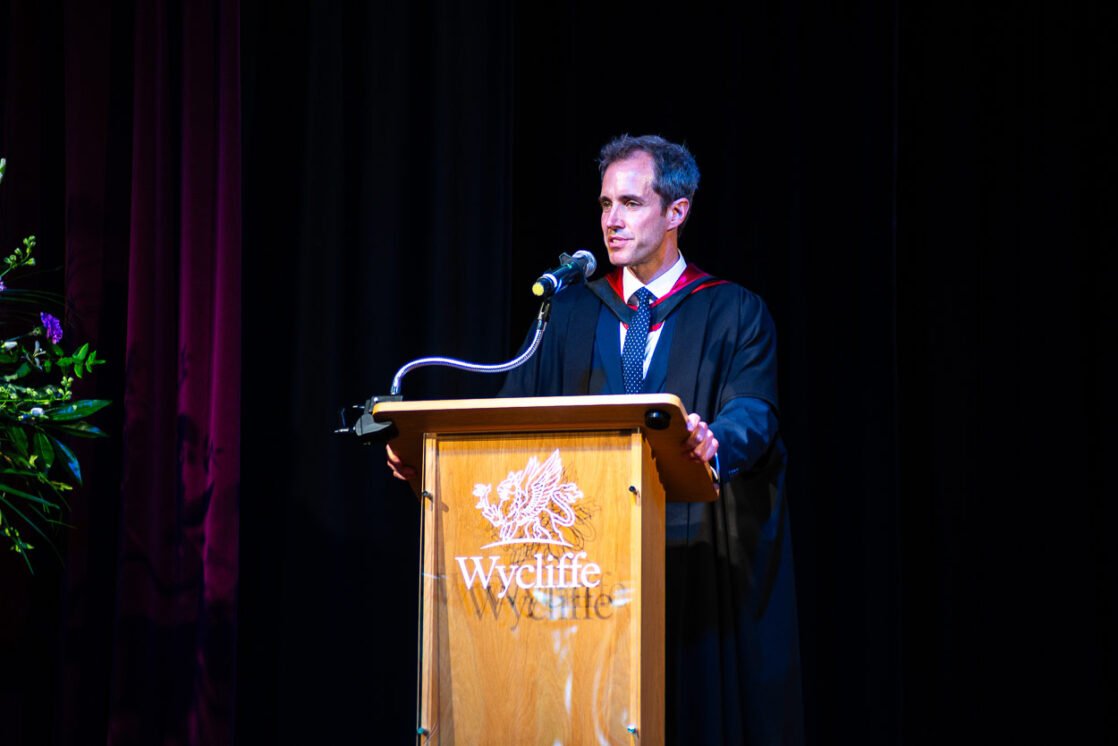 Christian at lectern