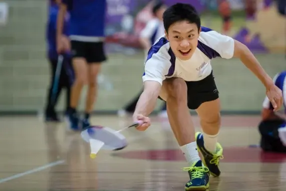 wycliffe boy playing badminton